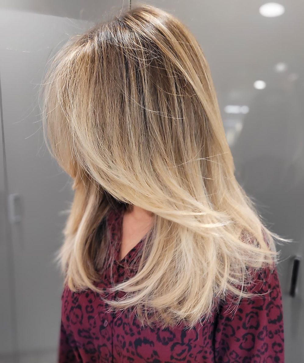 Long Blonde Hair with Feathered Ends